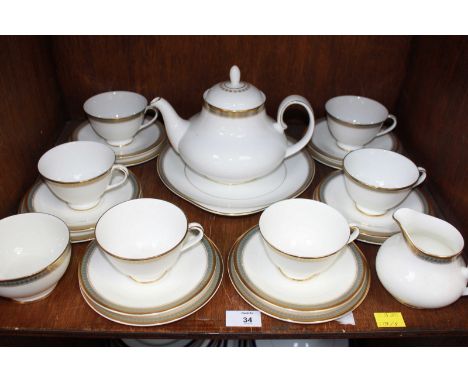 SECTION 34.  A Royal Doulton "Clarendon" pattern six-place teaset with teapot, cream and sugar bowl, six-each cups, saucers a