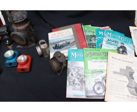 A collection of six various bicycle lights, together with a railway light and a collection of model car magazines.  