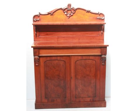 A Victorian mahogany chiffonier, with carved rail and shelf back, over a single drawer with a pair of panel doors below, acan