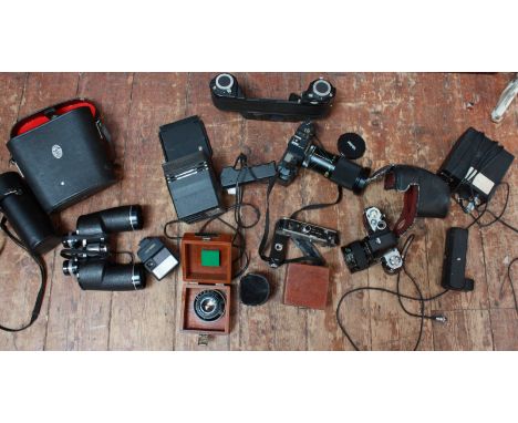 A collection of assorted camera by Nikon, Canon and others and a pair of Chinon binoculars.