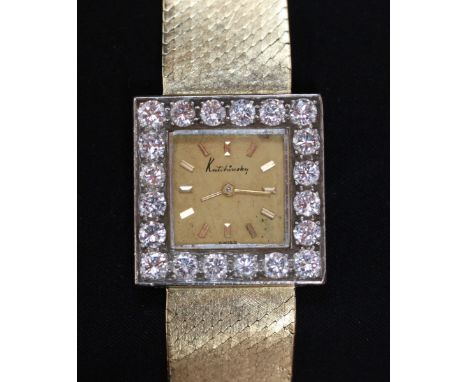 An 18ct gold and diamond Kutchinsky wrist watch, the square dial surrounded by 20 diamonds  spreading approximately 0.10cts e