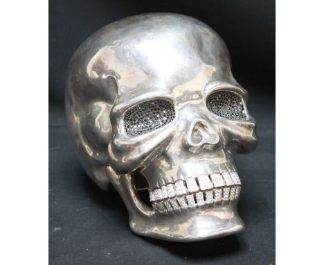 A contemporary sterling silver and diamante set life size model of a skull in the manner of Damien Hirst. Hallmarked London 2