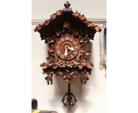 A Camerer, Kuss & Co carved cuckoo clock, with spring-driven movement  