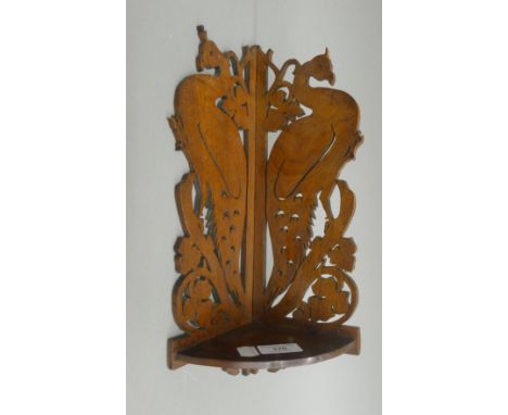 A late 19th/early 20th century fret carved corner shelf. 37 cm high.