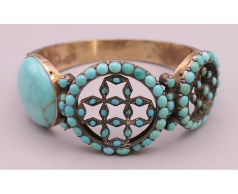 A Victorian silver turquoise bangle.  5.75 cm internal diameter. 