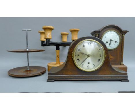 A 1930s mantel clock with Westminster chimes and pendulum; together with a 19th century architectural clock case and face, a 