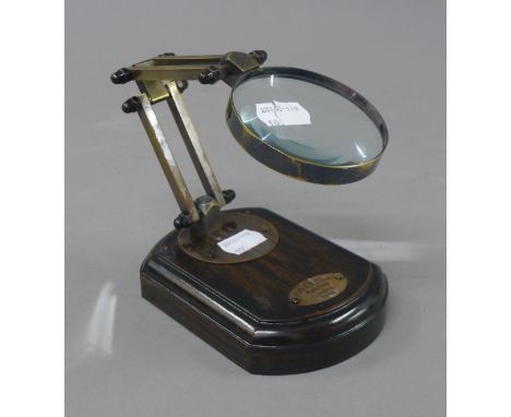 A magnifying lens on stand. 