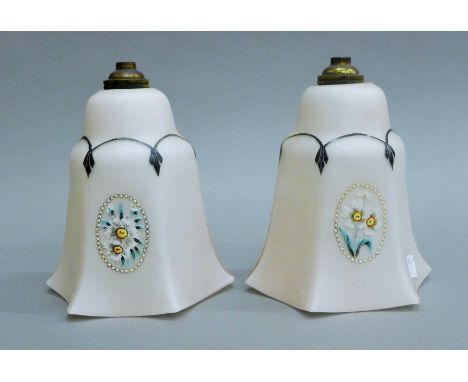 A pair of early 20th century painted pink glass light shades. 17 cm high.