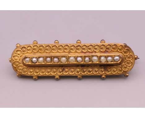 A 9 ct gold seed pearl set brooch.  4.5 cm long. 3.4 grammes total weight.