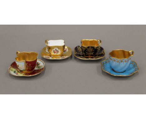 Four Coalport porcelain cabinet cups and saucers. The largest cup 4 cm high.