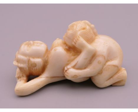 An erotic bone netsuke. 5.25 cm long.