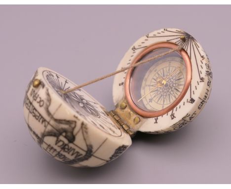A bone globe form compass.  4 cm high. 