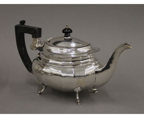 A silver teapot. 29 cm long. 18.3 troy ounces total weight.