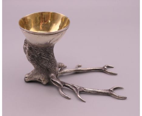 A silver deer head form stirrup cup, bearing Russian marks.  7 cm high. 105.8 grammes.