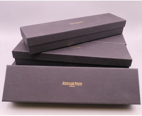 Six wooden Audemars Piguet bracelet/watch boxes, each with cardboard protective box.  25 cm x 5.75 cm. 