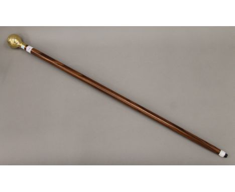 A walking stick, the handle formed as a globe. 93 cm long.