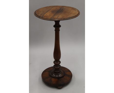 A rosewood tripod table. 71.5 cm high.