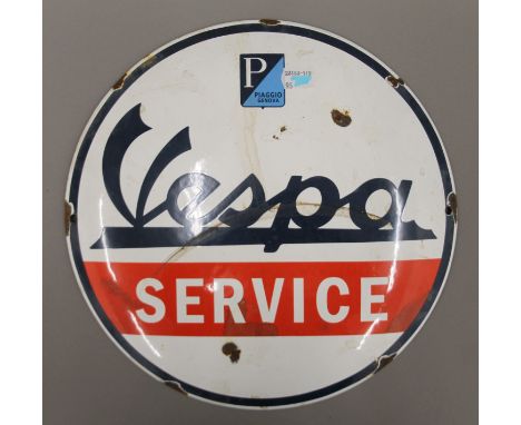 An enamel Vespa sign. 29 cm diameter.