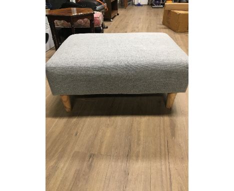 GREY UPHOLSTERED LARGE POUFFE ON LEGS