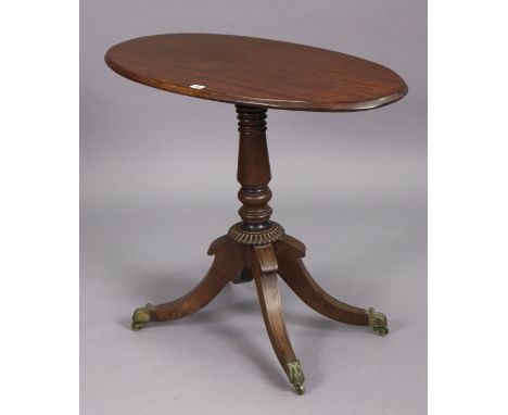 A 19th century mahogany oval tripod table with an oval top, &amp; on a vase-turned centre column &amp; four cabriole legs wit