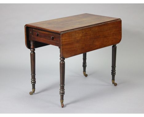 A Victorian mahogany Pembroke table, fitted with a drawer to one end, on turned tapering legs with ceramic castors, 88cm wide