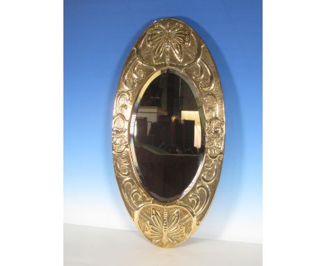 A small Arts and Crafts oval brass Wall Mirror with embossed design of butterflies and scrolls 