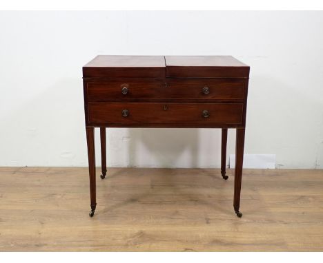 A 19th Century mahogany Washstand with folding hinged top opening to reveal an easel mirror and covered compartments above a 
