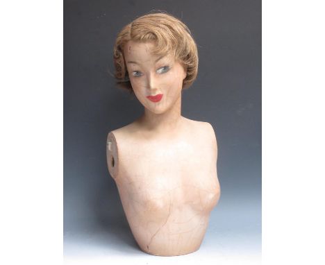 An early 20th Century plaster mannequin Bust with short blonde hair, stamped Imans, Paris 1ft 11in H (crack in lower half) 