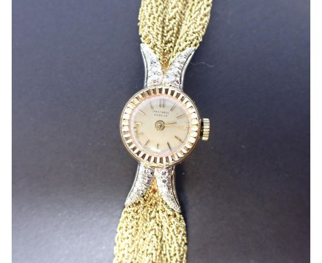 A lady's Universal, Geneve Cocktail Watch the champagne dial with hourly baton markers, the forked lugs pavé-set eight-cut di