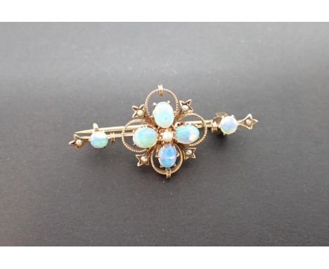 A Continental Opal and Seed Pearl Brooch claw-set oval opal cabochons with seed pearls between, marked 333, approx 40mm long,