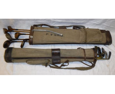 Two vintage golf club bags containing various vintage hickory shafted golf clubs to include Hinckley, etc 