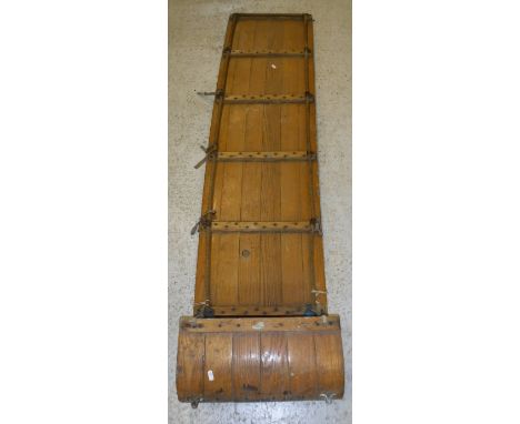 A vintage pine toboggan CONDITION REPORTS Has various wear etc to the varnish.  Scrapes and bumps all conducive with age and 
