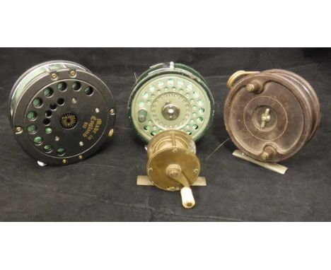A Daiwa Model 812 salmon fly reel, an Olympic trout fly reel, an Allcocks Aerialite and a small brass crank wind reel (4)