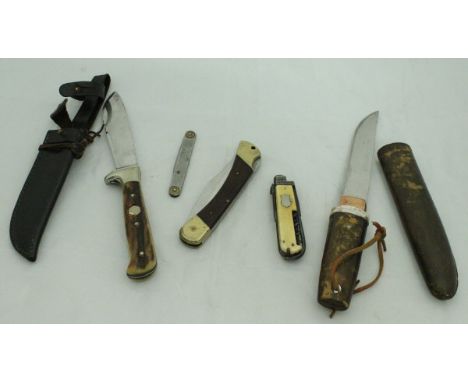 A bag containing five various knives, two Puma knives, one with antler handle and leather case, two penknives, one with ivory