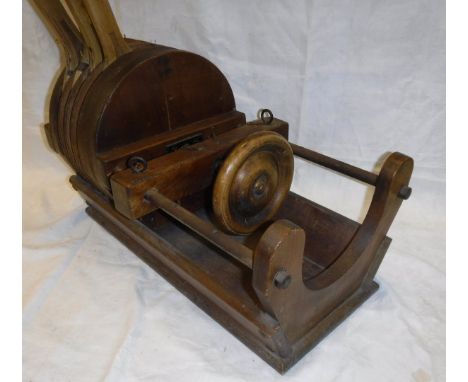 A mahogany adjustable tennis racket press in the manner of Slazenger for twelve rackets, together with four various vintage t