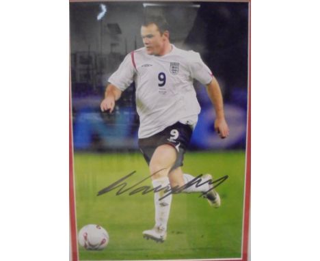 A framed and glazed autographed photographic print of Wayne Rooney and a framed and glazed autographed photographic print of 