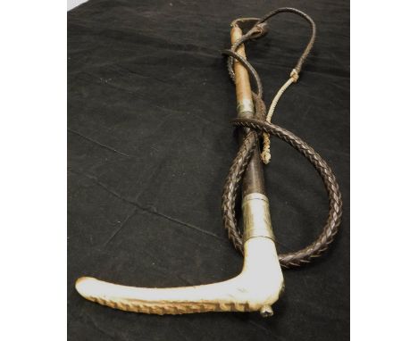 A gentleman's riding crop with antler handle and steel ferrule, with leather and plaited string shaft with leather thong, bea