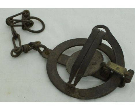 A vintage iron animal trap of circular form CONDITION REPORTS 17 cm diameter x 9.5 cm in height