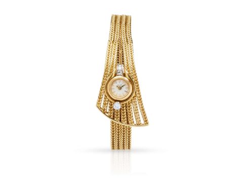  Piaget: A mid-20th century diamond cocktail watch  The circular dial with baton indicators, to a tapering woven-link bracele