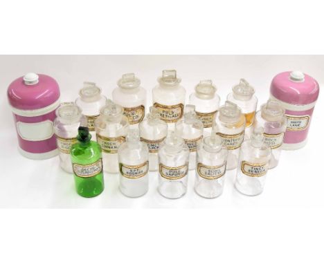 Sixteen Victorian glass apothecary chemist bottles with stoppers, with gilt border labels, (faults), tallest 9" high; also tw