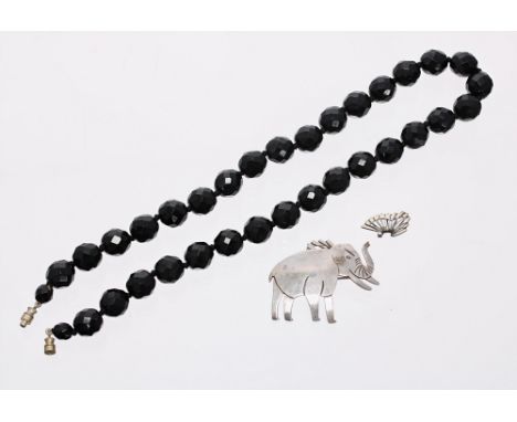(ref. 2952) faceted black bead necklace and a silver elephant brooch (at fault) (2)