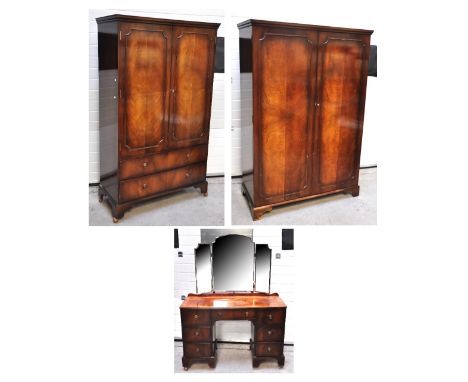 Two matching mahogany wardrobes one with two drawers to base, larger of the two 186 x 122cm, and an Edwardian dressing table 