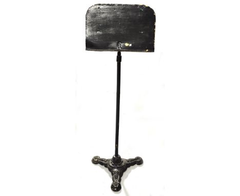 A Victorian cast iron tripod base, with later music or book stand upper section, height 115cm.