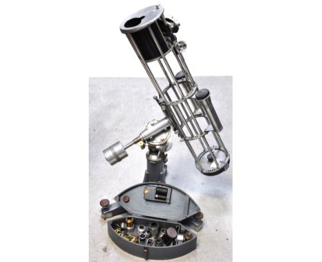 A large Newtonian reflecting telescope, complete with equatorial mount and a box of assorted eye pieces an accessories, with 