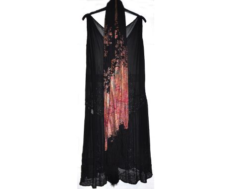 A 1920s black silk chiffon beaded flapper dress with matching black flower string silk scarf. CONDITION REPORT Small repairab