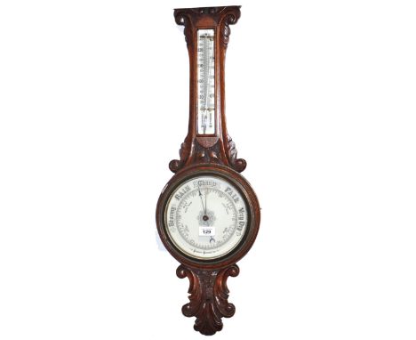 An oak aneroid barometer, 85cm.