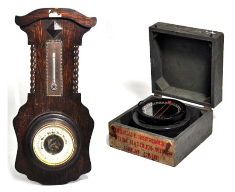 A boxed WWII period type P8 ships compass bearing a plaque inscribed "A.M. 6A/0.726" the bezel no. 94602H, also an oak aneroi