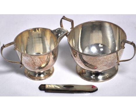 A George V hallmarked silver jug, Chester 1928, height 6.5cm, a hallmarked silver basin, marks rubbed, height 7cm and a furth