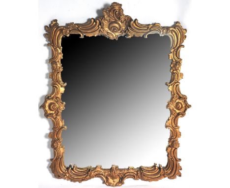 A 19th century gilt framed wall mirror with scrolling decoration, 65 x 53cm.