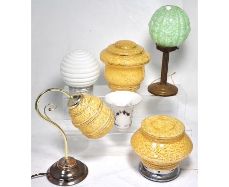 A retro yellow glass table lamp and a matching retro glass shade, a retro brass lamp with a round green glass shade and a fur